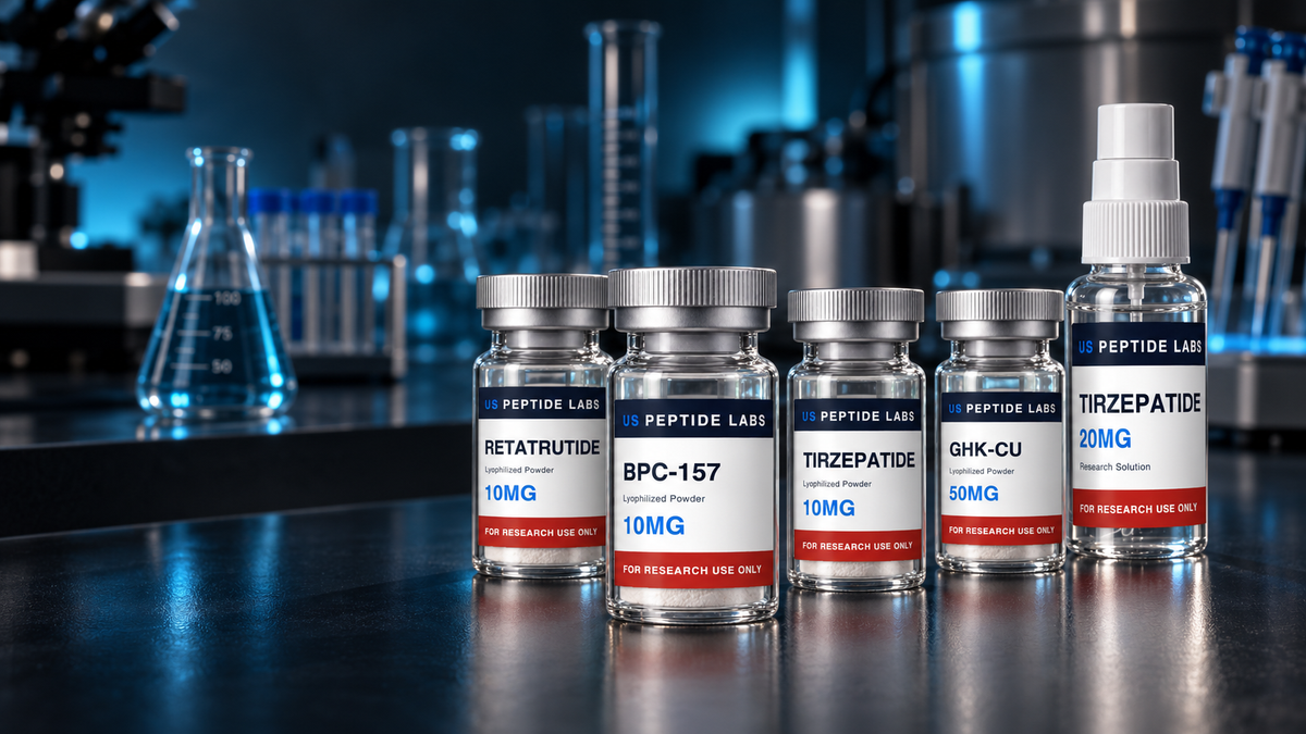 US Peptide Labs research vials and spray bottle on a dark laboratory bench